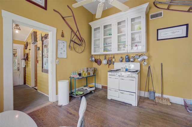 kitchen featuring ceiling fan, dark hardwood / wood-style flooring, and vaulted ceiling