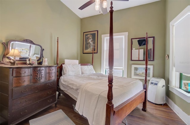 bedroom with dark wood-type flooring and ceiling fan