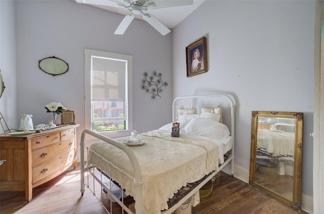 bedroom featuring ceiling fan and dark hardwood / wood-style flooring