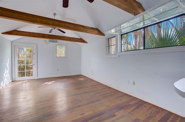 unfurnished room featuring ceiling fan, lofted ceiling with beams, and hardwood / wood-style floors