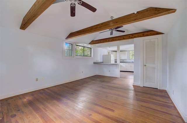 unfurnished living room featuring lofted ceiling with beams, ceiling fan, and dark hardwood / wood-style floors