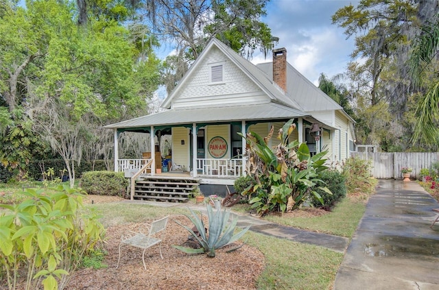 country-style home with covered porch