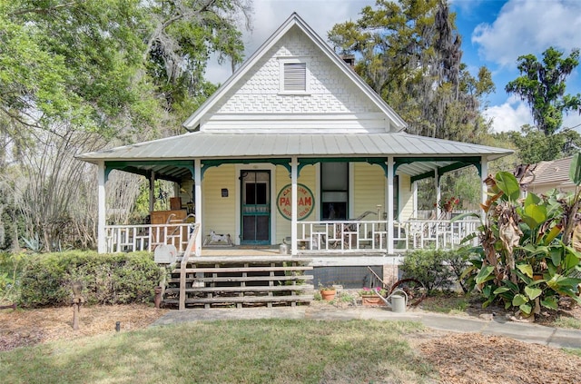 country-style home with covered porch