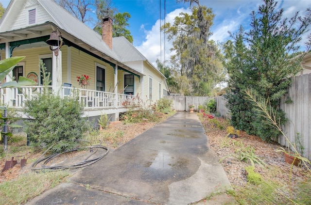 view of property exterior with a porch