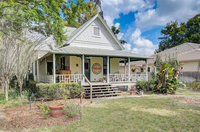 farmhouse-style home featuring a front yard and a porch