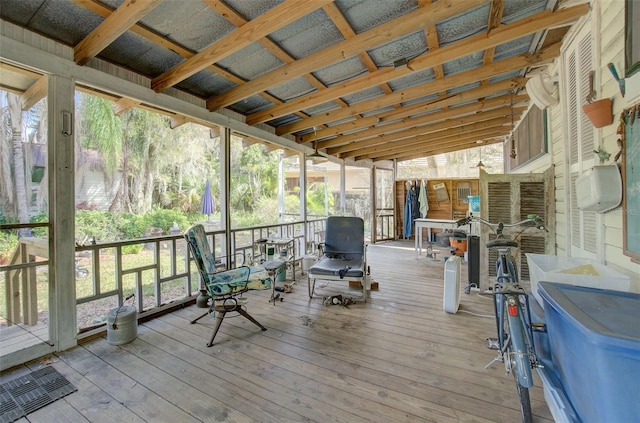 unfurnished sunroom with vaulted ceiling