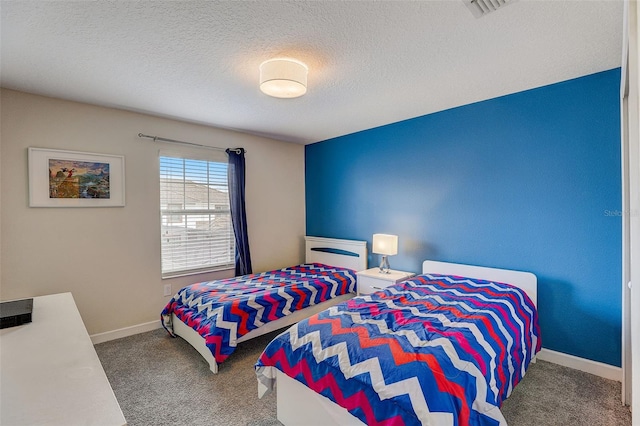 carpeted bedroom featuring a textured ceiling