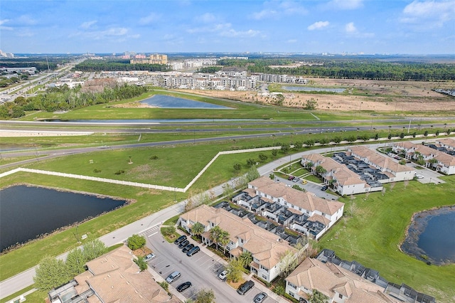 birds eye view of property featuring a water view