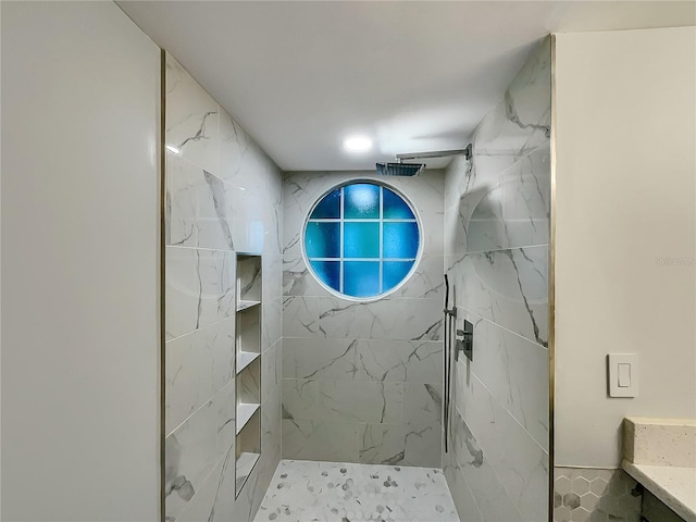 bathroom featuring tiled shower