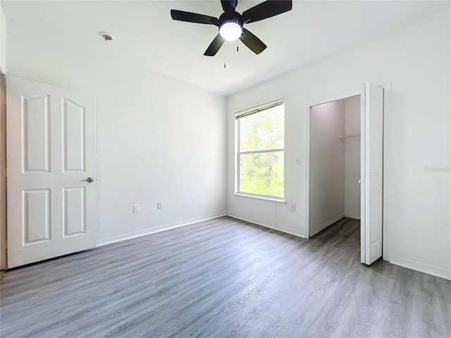 spare room featuring ceiling fan and light hardwood / wood-style flooring