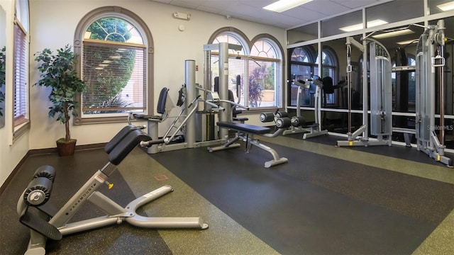 exercise room with a drop ceiling