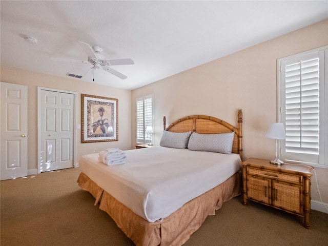 bedroom with carpet flooring, ceiling fan, and a closet