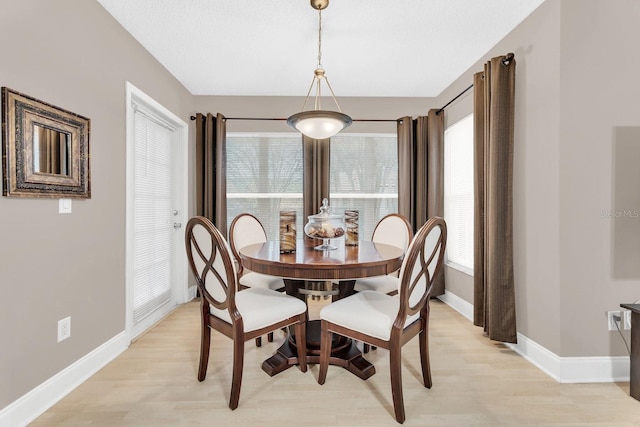 dining area with light wood-type flooring