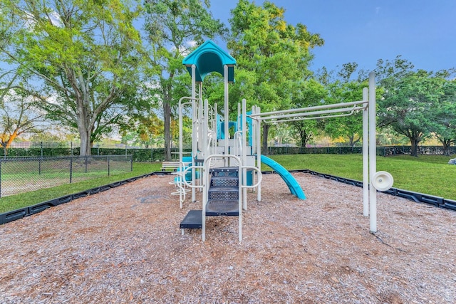 view of playground with a lawn