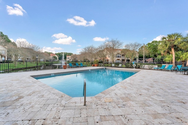 view of swimming pool with a patio area