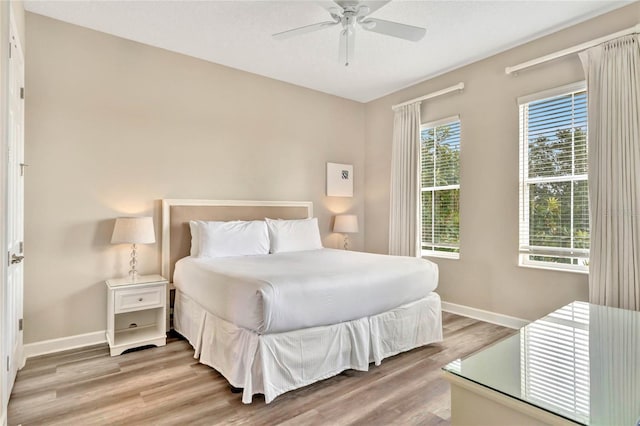 bedroom featuring light hardwood / wood-style floors and ceiling fan