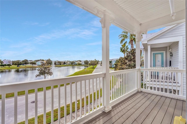 wooden terrace with a water view