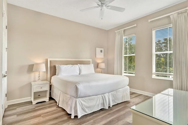 bedroom featuring light hardwood / wood-style flooring and ceiling fan