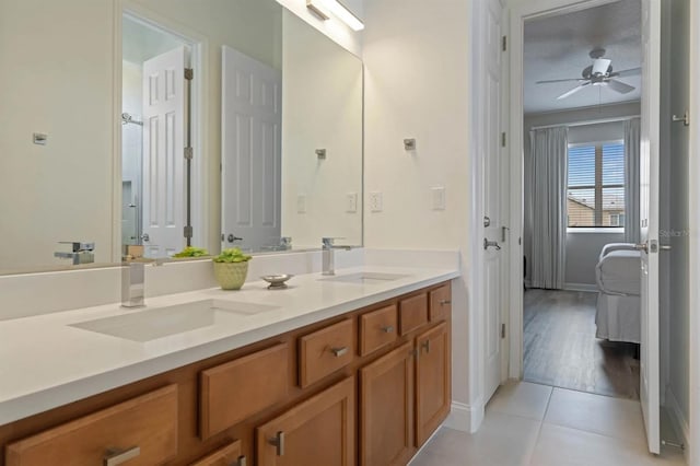 bathroom with vanity, wood-type flooring, and ceiling fan