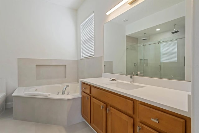 bathroom featuring vanity and shower with separate bathtub