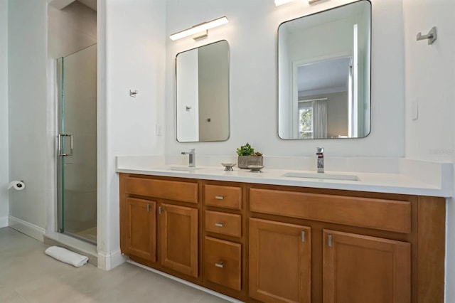 bathroom with a shower with door and vanity