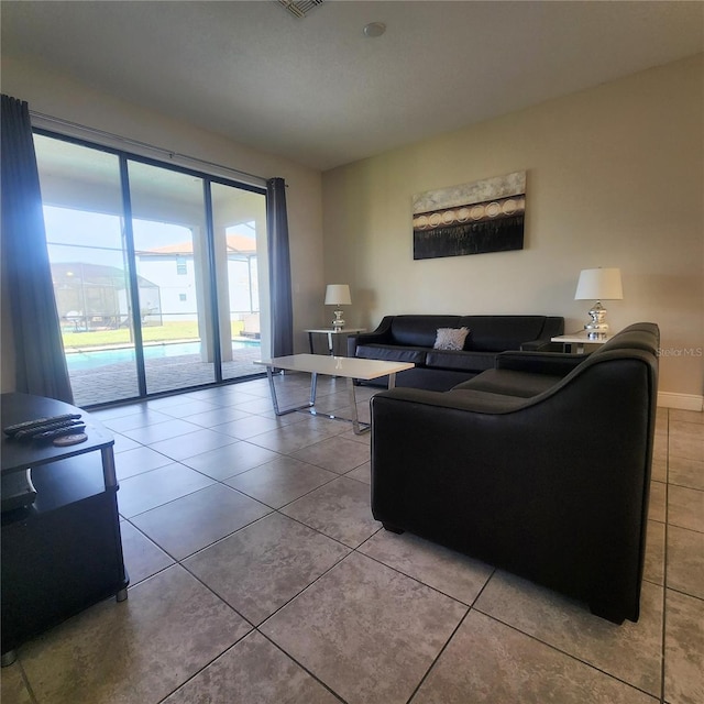 living room featuring light tile floors