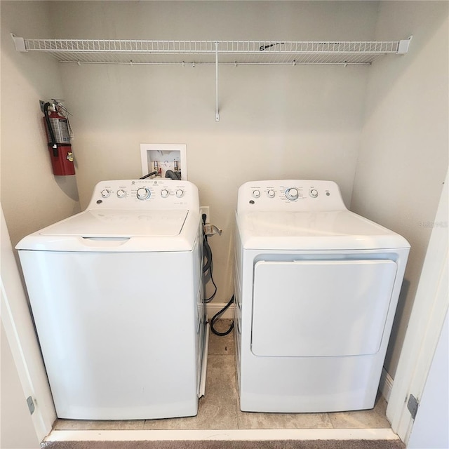 washroom with hookup for a washing machine and washer and dryer