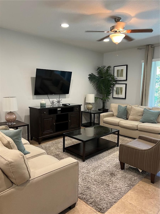 living area featuring ceiling fan, light tile patterned floors, and recessed lighting