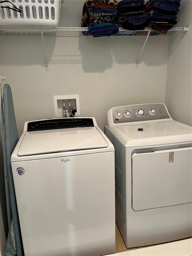 laundry area with laundry area and washing machine and dryer