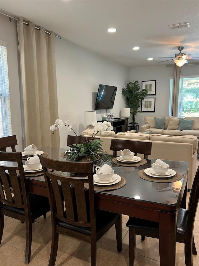 dining space with light tile patterned floors, visible vents, a ceiling fan, and recessed lighting