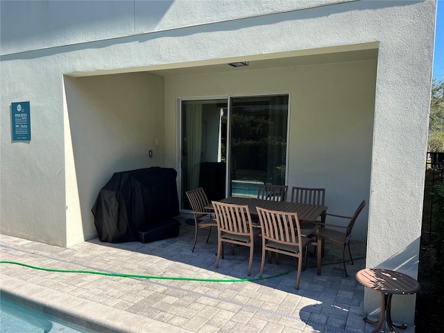 view of patio / terrace with outdoor dining area and grilling area