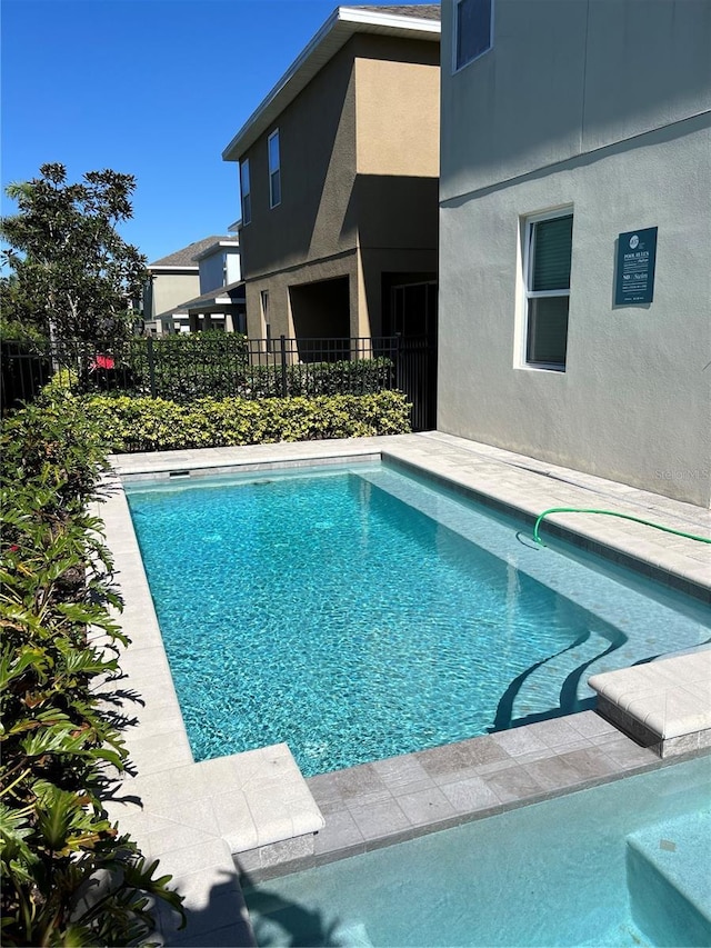 view of pool featuring fence and a fenced in pool