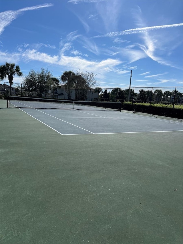 view of sport court with fence