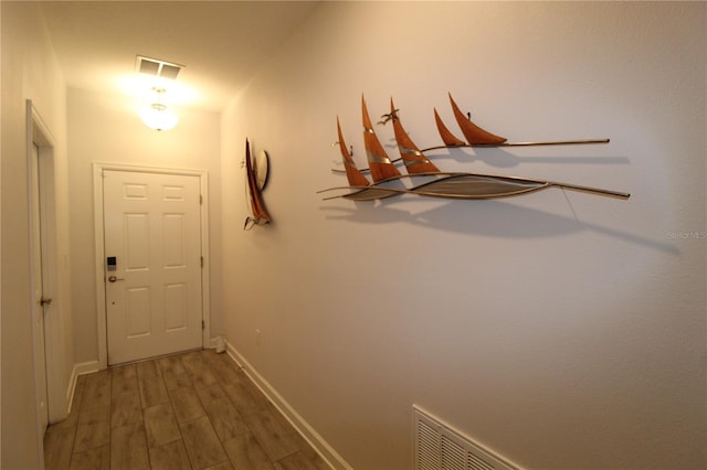 doorway to outside featuring dark wood-type flooring