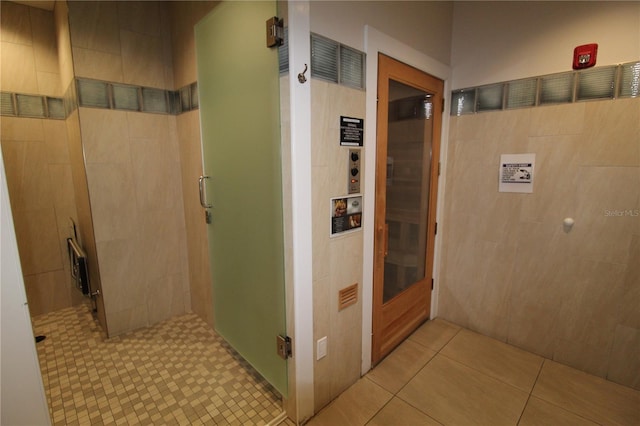 corridor with light tile patterned flooring