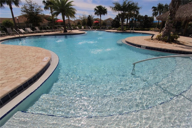 view of pool at dusk