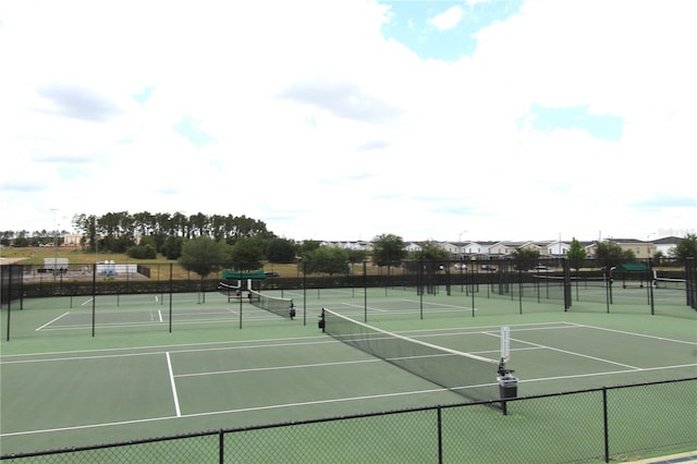 view of tennis court featuring basketball court