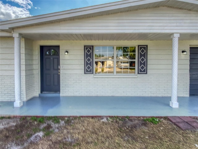 doorway to property featuring a porch