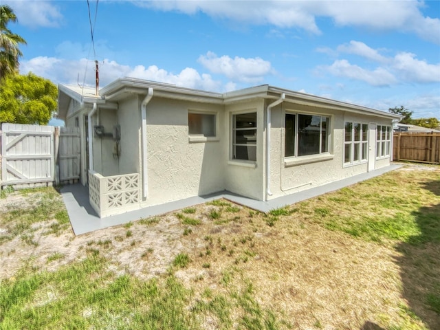 rear view of house with a lawn