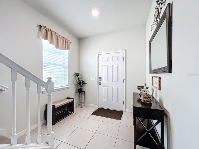 entryway featuring light tile flooring