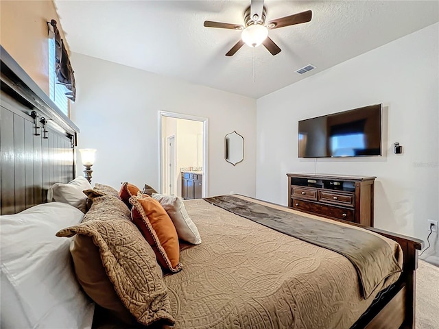 bedroom featuring ensuite bath and ceiling fan