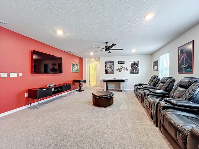 carpeted living room with a textured ceiling and ceiling fan