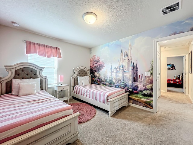 carpeted bedroom featuring a textured ceiling