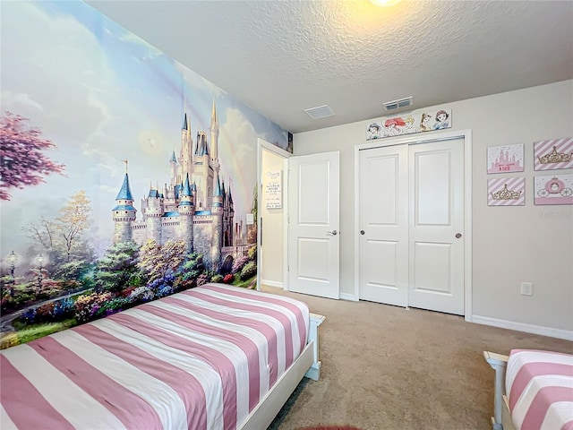 carpeted bedroom featuring a textured ceiling and a closet