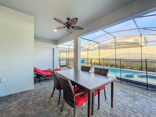 sunroom / solarium featuring a pool and ceiling fan