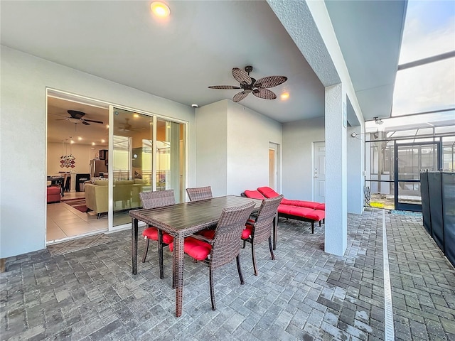 tiled dining area featuring ceiling fan