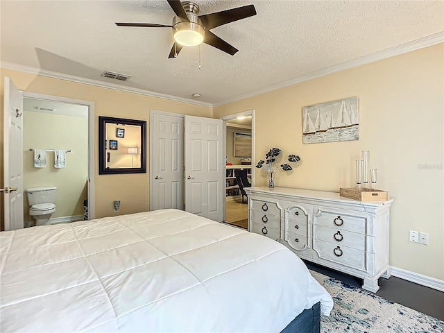 bedroom with ensuite bath, ceiling fan, a textured ceiling, and crown molding