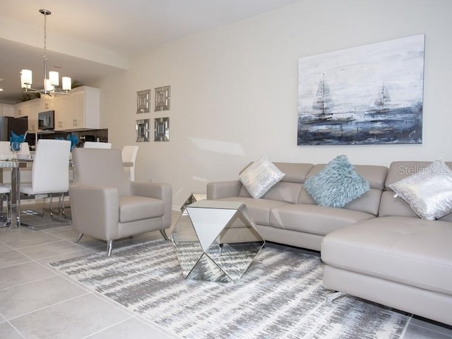 tiled living room featuring a chandelier