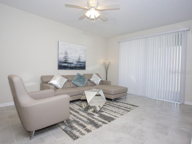 tiled living room with ceiling fan