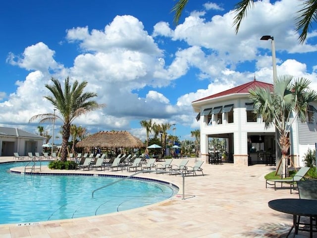 view of pool featuring a patio